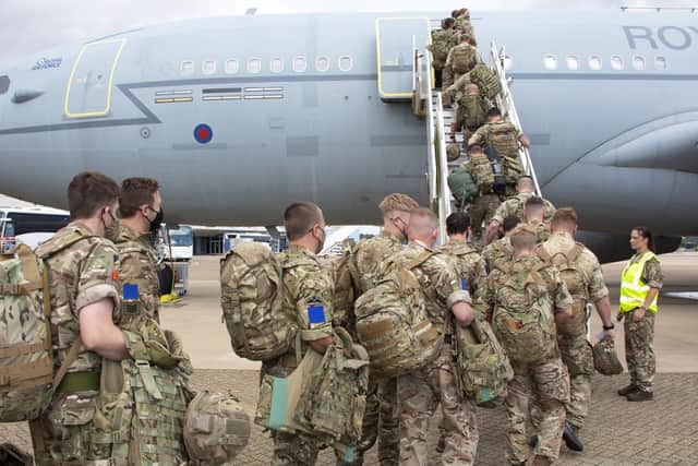 Handout photo 14/08/21 issued by the Ministry of Defence (MoD) of UK military personnel prior to boarding an RAF Voyager aircraft at RAF Brize Norton in Oxfordshire, as part of a 600-strong UK-force sent to assist with the operation to rescue British nationals in Afghanistan. I