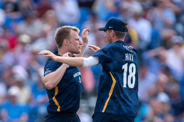 Two of the best: A lot of young Yorkshire players in the Royal London Cup campaign, including Matthew Waite, left, and George Hill, right, who celebrate a wicket against Warwickshire at York. (Picture: Bruce Rollinson)
