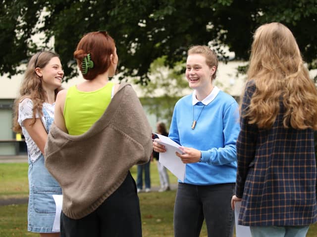 Sophie Lofthouse (second right) and Hannah Walton-Hughes (left) react as students at The Mount School, York, receive their A-Level results: Danny Lawson/PA Wire