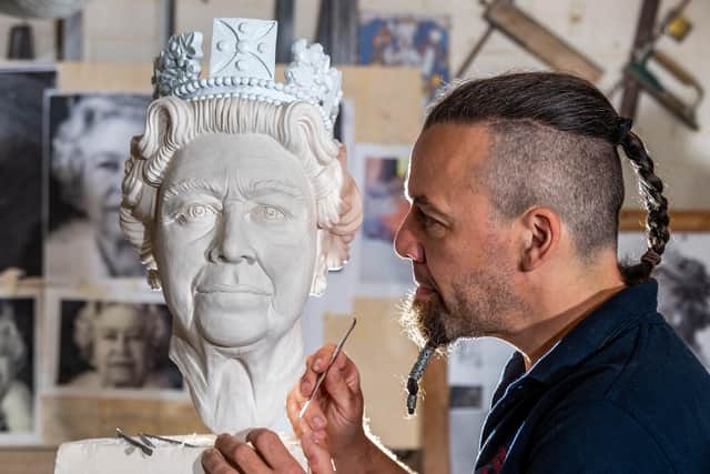 The carved head of Her Majesty The Queen designed by Richard Bossons, one of York Minster's stonemasons.