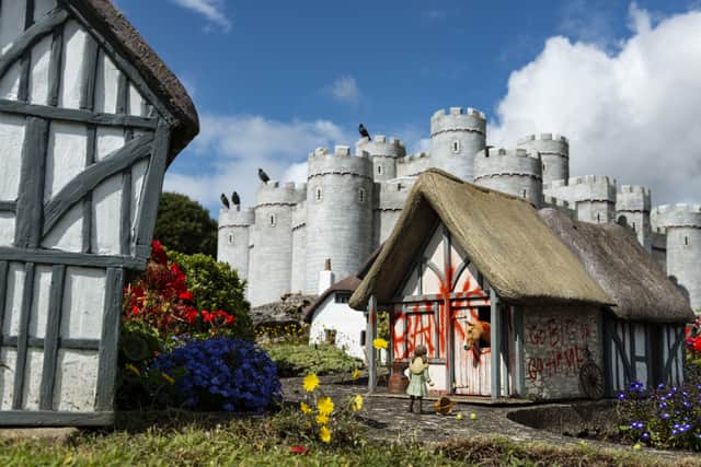 One of the new works by Banksy, on one of the model houses in the Merrivale Model Village.