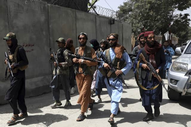 Taliban fighters patrol in Wazir Akbar Khan neighborhood in the city of Kabul, Afghanistan, Wednesday, Aug. 18, 2021. (AP Photo/Rahmat Gul)