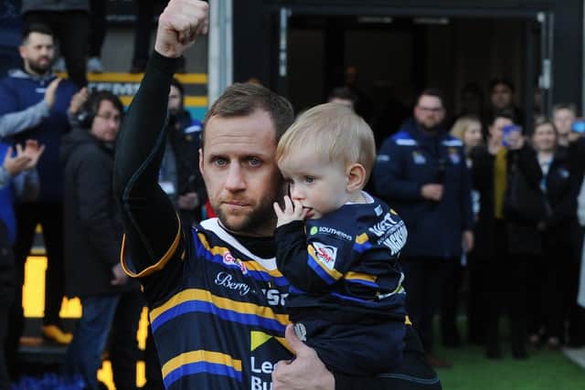Guest of honour: Leeds Rhinos legend Rob Burrow, pictured above with son Jackson at last year’s fundraising game, will be back at Headingley tonight where he will launch his autbiography. Picture: Steve Riding