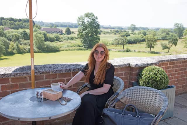 Katherine Busby wears black maxi dress. The holdall is by David Hampton. Picture by Vanessa Wilcox.