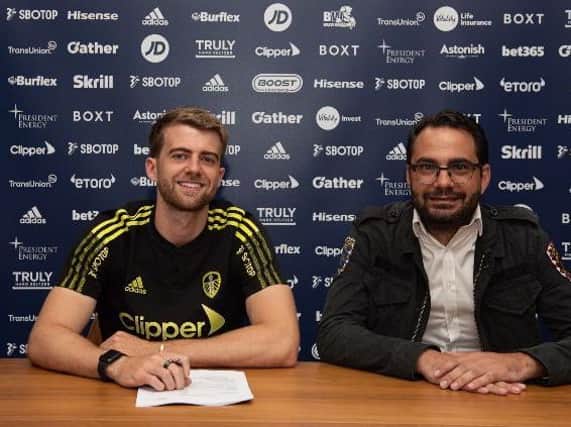 Deal me in: Leeds United striker Patrick Bamford pictured with sporting director Victor Orta. Picture courtesy of Leeds United AFC.