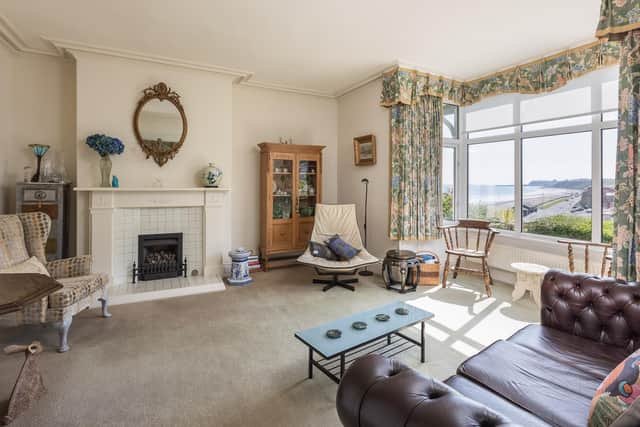The large sitting room with magnificent view out over the bay