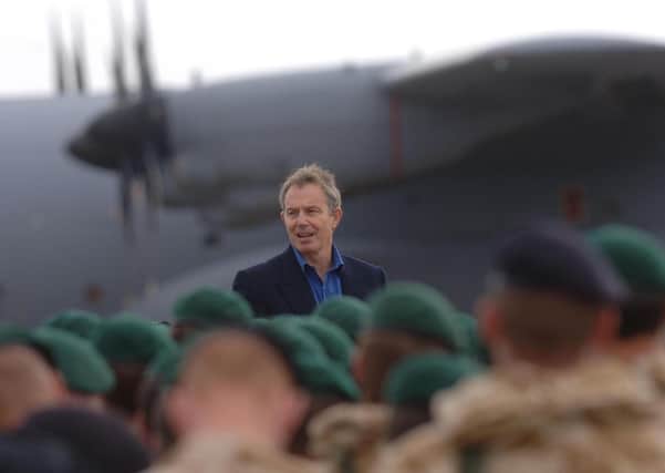 PA file photo dated 20/11/2006 of Prime Minister Tony Blair addressing British troops at Camp Bastion in Helmand Province, in Afghanistan.