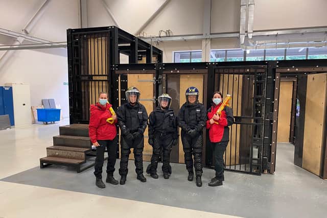 Women used battering rams to break down doors as it was revealed fewer than 5% of officers trained to do so are female. Picture: Twitter/@WYP_HBrear