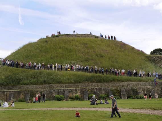 Visitors line up to climb the Great Motte on the open day in 2019