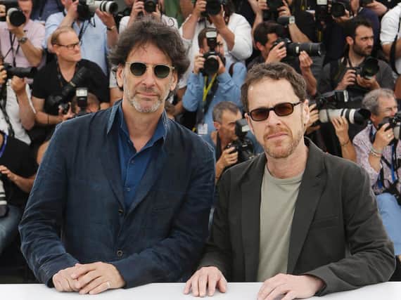 Joel Coen, right, and Ethan Coen pose for photographers at the 2015 Cannes Film Festival (AP Photo/Lionel Cironneau)