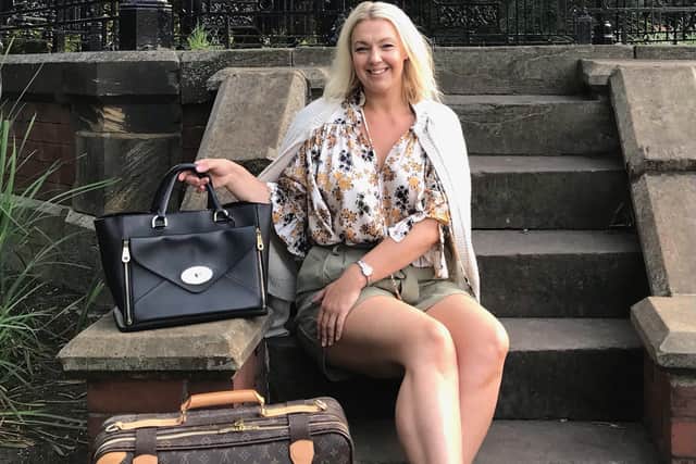 Alex Payne wears cardigan by Queene & Belle, blouse by Victoria Beckham, shorts by Acne Studios, shoes by YSL, bag by Mulberry and suitcase by Louis Vuitton.