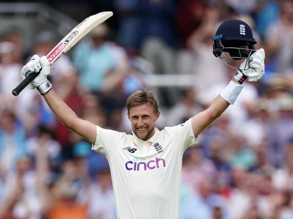 Joe Root celebrates after scoring his century during day three of the Second Test match at Lord's
