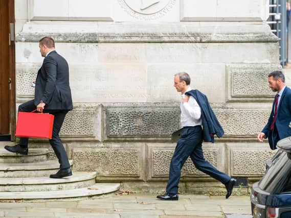 Foreign Secratary Dominic Raab (centre) arrives at the Foreign Office in Westminster, London, as he faces mounting pressure to resign after it emerged a phone call requested by his officials to help interpreters flee Afghanistan was not made. Picture: Dominic Lipinski/PA Wire