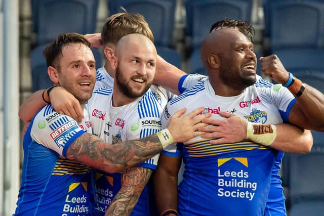 KEY WIN: Leeds Rhinos players celebrate during Thursday's win over Huddersfield Giants. Picture: Allan McKenzie/SWpix.com.