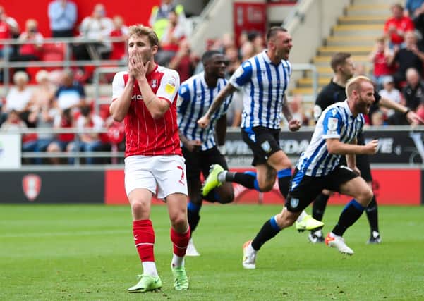Rotherham United's Kieran Sadlier reacts after his penalty is saved by Sheffield Wednesday's Bailey Peacock-Farrell at the New York Stadium. Picture: Isaac Parkin/PA