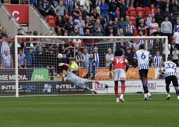 BIG MOMENT: Sheffield Wednesday goalkeeper Bailey Peacock-Farrell saves a penalty kick from Rotherham's Kieran Sadlier just before half time. Picture: Steve Ellis