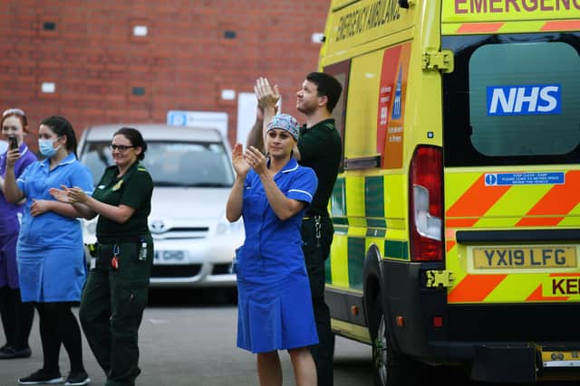 Ambulance crews taking part in a Clap for Carers celebration at Leeds General Infirmary during the pandemic. Photo: Jonathan Gawthorpe.