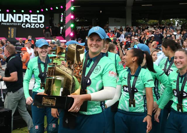 Oval Invincibles' Dane van Niekerk lifts the inaugural Hundred trophy after beating Southern Brave in the Women's Final at Lord's. Picture: Steven Paston/PA