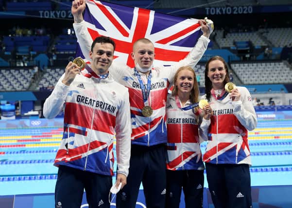 Gold medalists James Guy, Adam Peaty, Anna Hopkin and Kathleen Dawson of Team Great Britain poses during the medal ceremony for the Mixed 4 x 100m Medley Relay Final at Tokyo Aquatics Centre on July 31, 2021 in Tokyo, Japan.