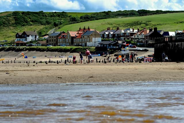 The beach at Sandsend is a popular spot with holiday-makers. Photo: James Hardisty.