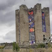 The banners now adorn the castle keep