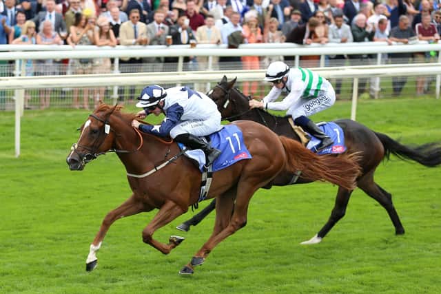 Zain Claudette and Ray Dawson (left) coming home to win the Sky Bet Lowther Stakes.