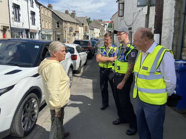 Crime commissioner Philip Allott and Bentham's two public safety officers chat to a member of the public.