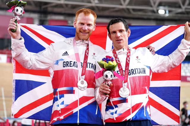 Great Britain's Stephen Bate (left) and pilot Adam Duggleby celebrate winning silver after the Men's B 4000m Individual Pursuit Final at the Izu Velodrome. Picture: Tim Goode/PA