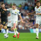 WELCOME RETURN: Adam Forshaw, seen battling with Crewe's Luke Murphy, above, ended a near two-year wait to play again when he lined up at Elland Road on Tuesday night. Picture: Bruce Rollinson.