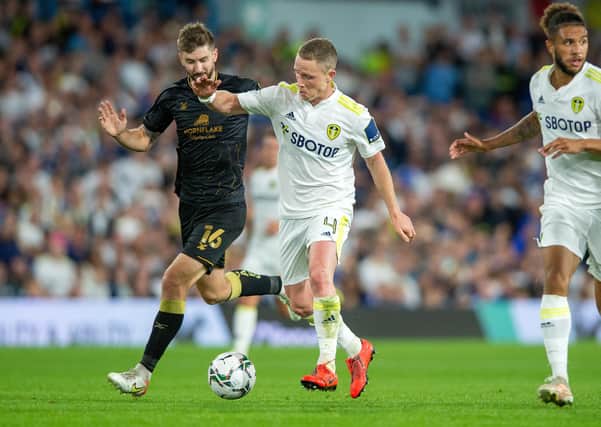 WELCOME RETURN: Adam Forshaw, seen battling with Crewe's Luke Murphy, above, ended a near two-year wait to play again when he lined up at Elland Road on Tuesday night. 
Picture: Bruce Rollinson.
