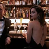 Photo issued by Danjaq, LLC/MGM of (left to right) Daniel Craig playing James Bond and Ana de Armas playing Paloma in the new Bond film No Time To Die. Picture: Nicola Dove.