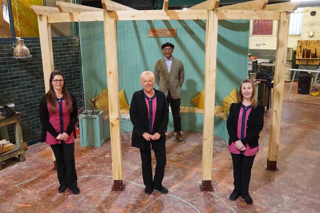 Jay Blades with contributors Karen, Lucy and Sandra standing in front of their bespoke arbour  - (C) Ricochet - Photographer: Andy Linfield