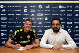 SIGNING ON: Leo Hjelde with Leeds United sporting director Victor Orta