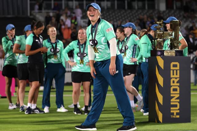 Oval Invincibles' Dane van Niekerk poses with the trophy after the Women's Final of The Hundred at Lord's. Picture: Steven Paston/PA