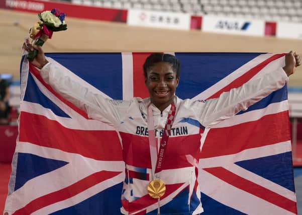 RECORD BREAKER: Great Britain's Kadeena Cox celebrates winning Gold in the Women's C4-5 500m Time Trial at Izu Velodrome this morning. Picture: PA.