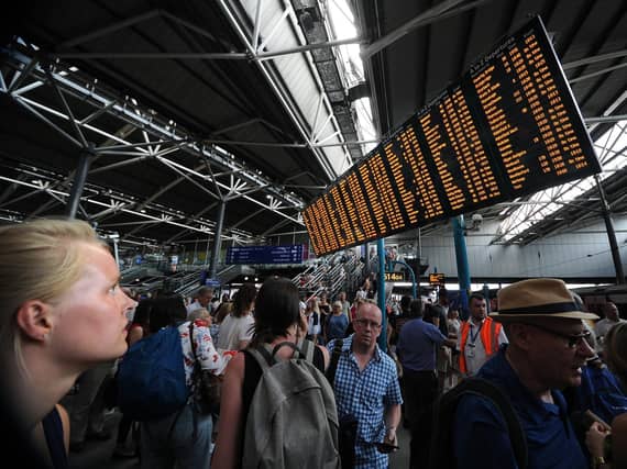 Passengers at Leeds Railway Station. Picture by Simon Hulme.