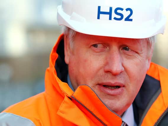 Prime Minister Boris Johnson pictured in February 2020 during a visit to Curzon Street railway station in Birmingham where the HS2 rail project is under construction. The future of the leg between Birmingham and Leeds is in doubt. Picture: PA