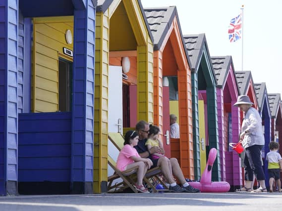People by the beach at Saltburn-by-the-Sea in North Yorkshire, July 2021 (PA/Owen Humphreys)