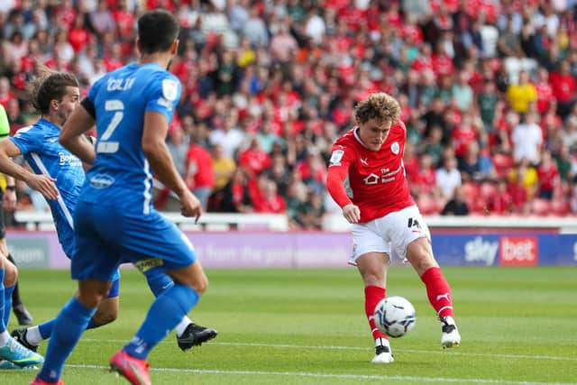 TAKE THAT: Barnsley's Callum Styles scores the opener against Birmingham City at Oakwell. Picture: Isaac Parkin/PA