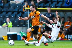 BACK ON TRACK: Bournemouth’s Ben Pearson battles Hull’s Lewie Coyle on Saturday. Picture: Mark Kerton/PA