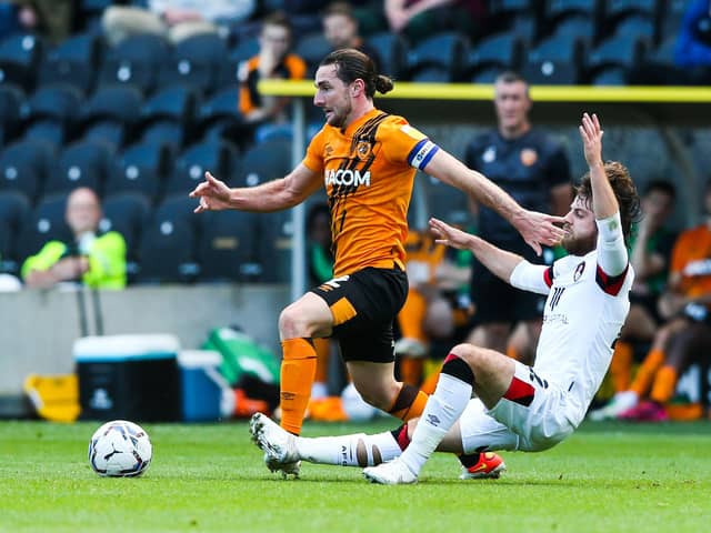 BACK ON TRACK: Bournemouth’s Ben Pearson battles Hull’s Lewie Coyle on Saturday. Picture: Mark Kerton/PA