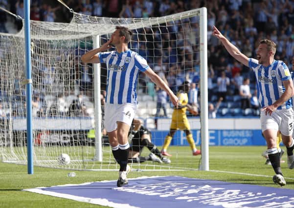 ON FIRE: Matty Pearson of Huddersfield Town celebrates scoring against Reading at Kirklees Stadium. Picture: John Early/Getty Images