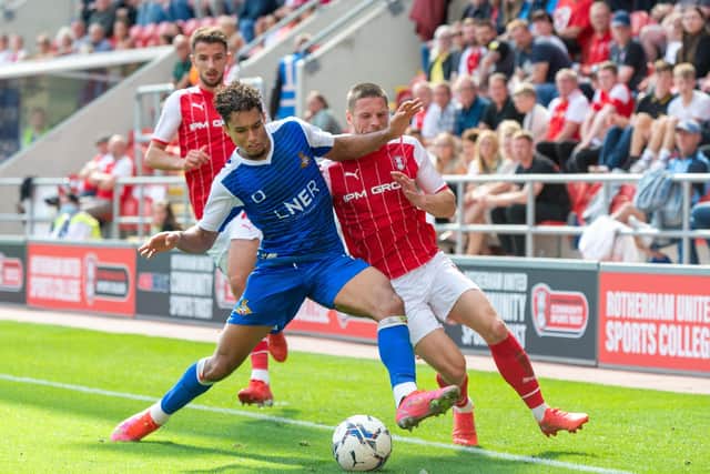 Kyle Knowle holds off Ben Wiles in Saturday's clash betwenn 
Rotherham United and Doncaster Rovers at the New York Stadium  Picture: Bruce Rollinson