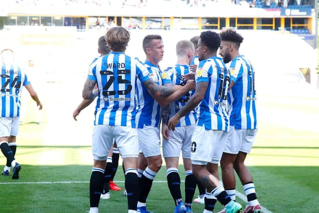 THREE IN A ROW: Huddersfield Town players celebrate with Lewis O'Brien after the midfielder sent the Terriers on their way to a third-straight league win. Picture: Getty Images.