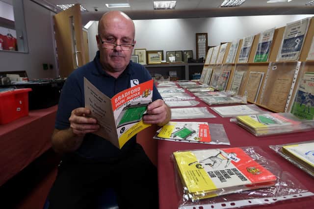 .Rob Lea is pictured looking at old Bradford Park Avenue Programmes in the sale