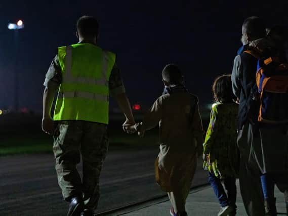 Handout photo issued by the Ministry of Defence (MoD) of arrivals at RAF Brize Norton who have been evacuated from Afghanistan, via the UAE, under the Afghan Relocation and Assistance Program (ARAP) (Cpl Will Drummee RAF/MOD/Crown copyright)