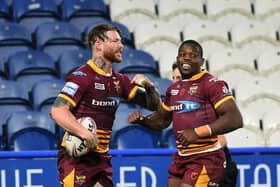 In tandem: Chris McQueen, left, could be back for Huddersfield and Jermaine McGillvary will be key on the right. (Picture: Jonathan Gawthorpe)