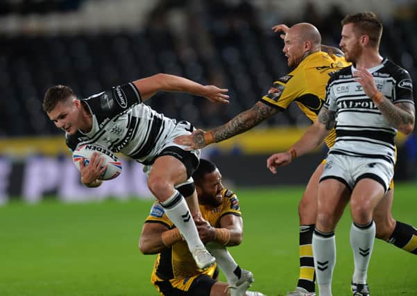 Progress halted: 
Hull's Cameron Scott is tackled by Tigers' Suaia Matagi last Thursday (
Picture: Jonathan Gawthorpe)
