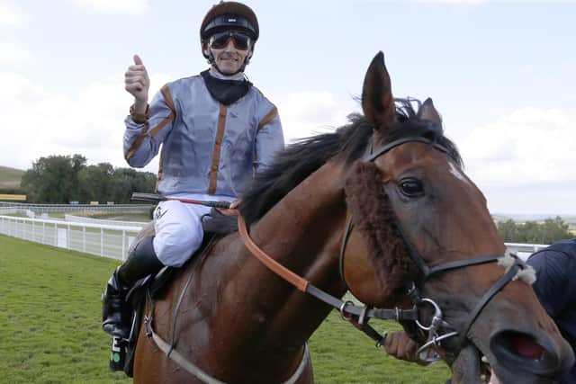 WINNER: Jockey Daniel Tudhope celebrates aboard Summerghand after winning the Unibet Stewards' Cup  at the Goodwood Festival last August. Picture: Dan Abraham/PA