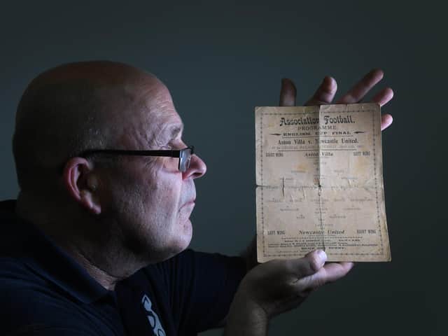 Football Memorabilia auction at Sheffield Gallery Auction House.Rob Lea is pictured looking at a match card from the 1905 FA Cup Final between Aston Vlla and Newcastle. PIcture: Simon Hulme.